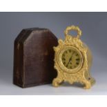 GILDED CARRIAGE CLOCK Around 1850, Bohemia (Prague) Fire-gilded bronze, signed at the back of the