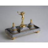 MARBLE INKWELL After 1850, France (Paris) Grey marble inkwell, mounted on a brass board, signed at