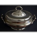 A SILVERPLATE SOUP TUREEN removable reeded handle lid with engraved borders, the tureen with applied