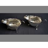 A PAIR OF GEORGE V SILVER SAUCE BOATS BIRMINGHAM 1927, S & B wavy rim, applied handle, standing on