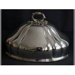 A SILVERPLATE MEAT DOME removable moulded handle, moulded in the form of acorns and leaves,