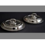 A NEAR PAIR OF WALKER & HALL SILVERPLATE ENTRÉE DISHES of oval form, with removable handles, 30 by