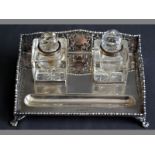 A GEORGE V SILVER INK STAND SHEFFIELD 1918, T.L. the ink tray with cut-out sides and back, housing