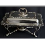 A SILVERPLATE BAIN-MARIE moulded leaf form handle, lid with applied moulded floral and scroll