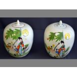 A PAIR OF CHINESE LIDDED GINGER JARS decorated in famille rose colours depicting a lady with