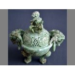 A 20TH CENTURY PALE GREEN CHINESE JADE TRIPOD INCENSE  BURNER AND COVER the carved body supported on