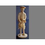 A LATE 19TH CENTURY JAPANESE IVORY CARVING OF A FARMER the standing figure of the farmer carved in