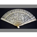 A 19TH CENTURY CANTON IVORY BRISé FAN the guards delicately carved with Mandarin figures, opening to