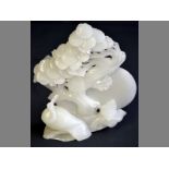 A CHINESE WHITE JADE CARVING, MODERN depicting a duck gazing at the moon, nestling under a tree,