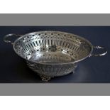 A GEORGE V SILVER BOWL SHEFFIELD 1927, S & W Ltd. with applied twin handles, gadrooned rim, body