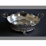 A 19TH CENTURY CONTINENTAL SILVER TWIN-HANDLED BOWL handles with embossed flowers, serpentine rim,