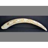 A WELL-CARVED ELEPHANT TUSK highly decorated, depicting two elephant families, stamped with