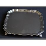 A GEORGE V SILVER CARD TRAY SHEFFIELD 1928, WALKER & HALL of square form, with serpentine reeded rim