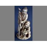 A FINE 19TH CENTURY JAPANESE IVORY CARVING  of a sage, his son and a toad, with added boxwood