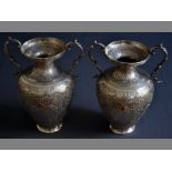 A PAIR OF 19TH CENTURY PERSIAN SILVER TWIN-HANDLED URNS scroll form handles, the baluster bodies