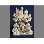 A 19TH CENTURY FINELY CARVED CHINESE IVORY FIGURAL GROUP of eight figures, showing a three character