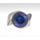 Ladies' Tanzanite, Diamond and Ruby Ring 14k white gold ring with a twist-design mounting, featuring