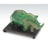 Carved Malachite Rhinoceros Carved and polished figure of a Rhinoceros in a walking stance,