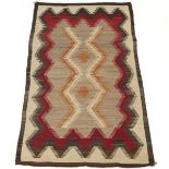 Navajo Blanket, ca. 1900-1940's  6'5" x 3'11"Homespun yarn in cochineal red, gold, grey, and
