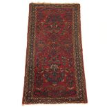 Hamadan Carpet, Early 20th Century 6'4" x 2'11"Wool on cotton weft, cherry red ground with