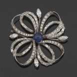 Platinum Diamond and Sapphire Brooch  2 x 2 in. Platinum ribbon flower shape brooch, set with