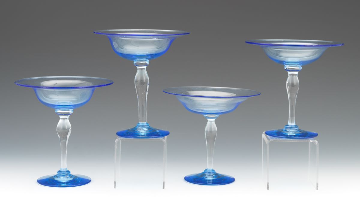 Four Blue Glass Compotes nullFour clear blue and clear blown glass compotes in a shape by Steuben,