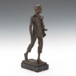 Adolf Josef Pohl (Austrian, 1872-1930)  11"T Patinated bronze of striding young man holding boots on