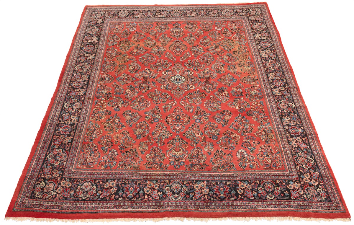 Sarouk Carpet, 20th Century 14'4" x 10'5"Wool on cotton weft. Thick pile, ground color red, floral