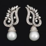 A Pair of Platinum, Diamond and South Sea Pearl Earrings  2 x 3/4 in. Platinum earrings set with