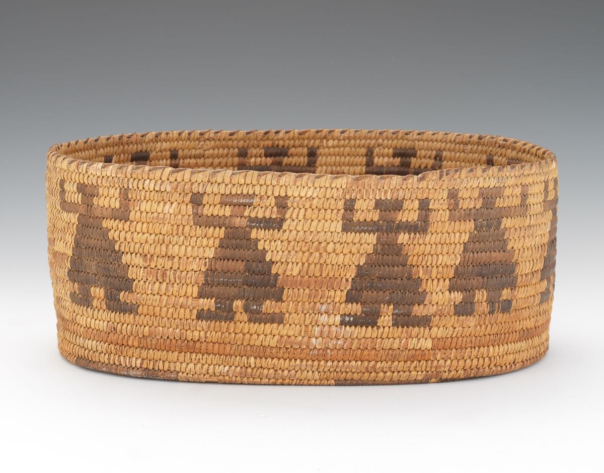 Tohono O'odham Basket, ca. 1940 9-7/8" x 13-1/4" x 5-1/2"Ovoid hand crafted basket with repeating