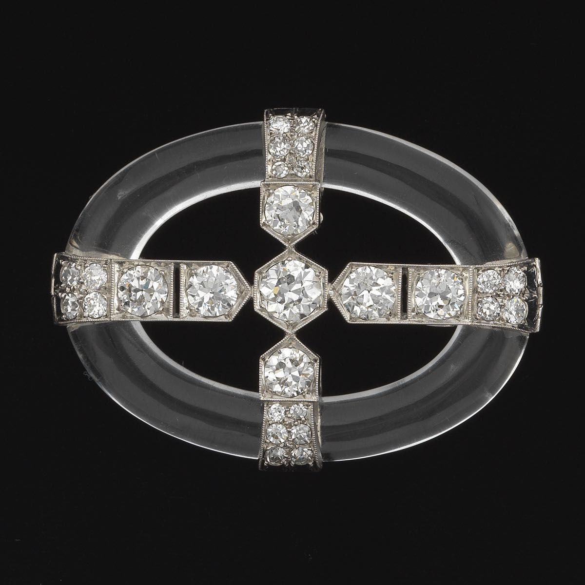 Diamond, Platinum and Rock Crystal Brooch  1-3/4 x 1-1/8 in. Oval shape brooch comprised of carved