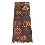 Kilim Capet, Early 20th Century 9'9" x 3'2"Wool on wool weft, wove carpet with natural dyes, knotted