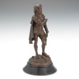 Bronze Figure of Gambler 13 1/4" Adorned in Renaissance garb with bags of gold and dice at feet,