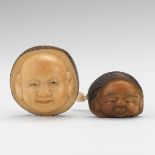 Two Carved Nut Netsuke nullTwo carved nut netsuke of faces; both signed; 2" x 2" and 1-3/8" x 1-5/