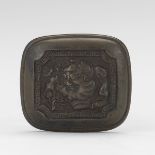 Metal Netsuke of an Oni 1-3/8" x 1-5/8"Rectangular metal netsuke with a man on one side and an oni