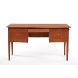 Danish Modern Wooden Desk 29-3/8" x 53" x 25-1/2"On four tapered legs, six pull-out drawers with one