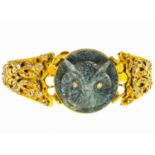 A gold and diamond bracelet, set with a well carved labradorite Cameo solitaire, Est. Dia. Wt. 2.