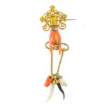 An antique gold, Mediterranean carved coral, turquoise and hard stone drop brooch. Length 6.8cm