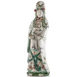 An antique Chinese Guanyin porcelain statue with polychrome enamel reliefs of birds and flowers,