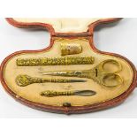 An antique gold and enamel sewing kit, in original fitted case, combined Wt. 53g Scissor length 9.
