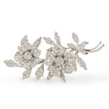 An antique gold and diamond flower brooch, Est. Dia. Wt. 3ct, Width 6.4cm Wt. 15.4g, In a fitted