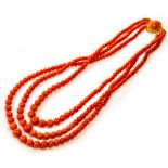 An antique Mediterranean coral three-row bead necklace. Length: 46cm. Wt. 88.4g. Coral Beads 7mm