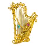 An antique gold, turquoise and ruby harp brooch, length 4cm Wt. 4.9g.