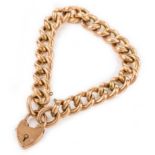 An Edwardian gold curb link bracelet with padlock clasp, length 22cm, Wt. 17.6g.