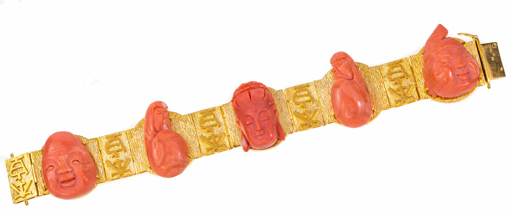 An antique gold and carved coral bracelet, length 21cm Wt. 108.1g.