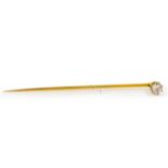 A gold and diamond set stickpin. Length 5.7cm, Wt. 1.3g. In a fitted case.