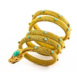 A Silver gilt turquoise and ruby serpent bracelet, marked 900. Wt. 27g, length 8cm.