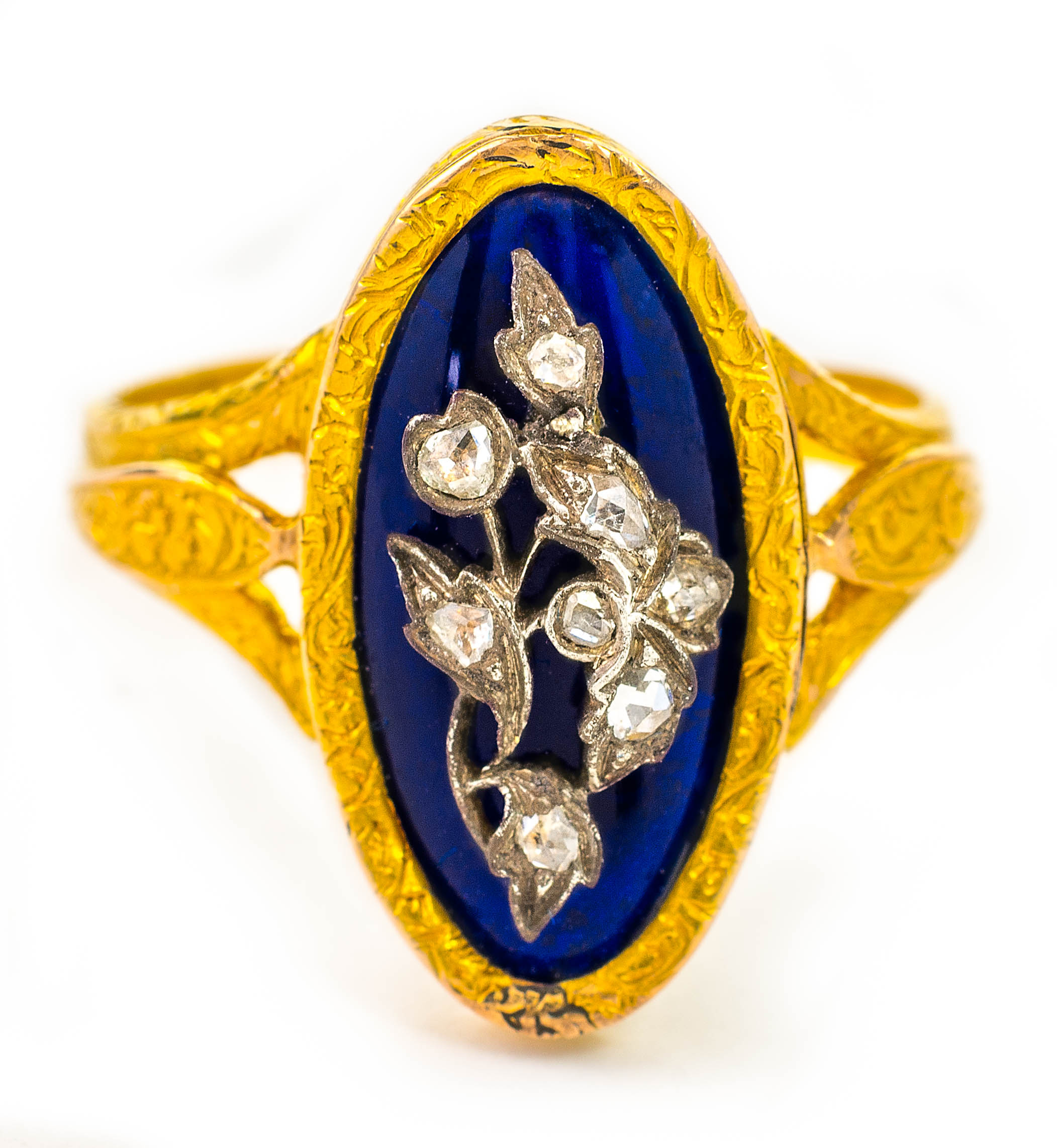 An antique gold, enamel and diamond ring, in fitted case, Wt. 3.6g, ring size N.