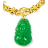 A Chinese gold and jadeite pendant necklace, pendant length 2.5cm width 1.6cm, necklace length 38cm.