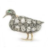 An emerald and diamond duck brooch, width 21mm. Est. Dia. Wt. 0.80ct Wt. 3.5g.